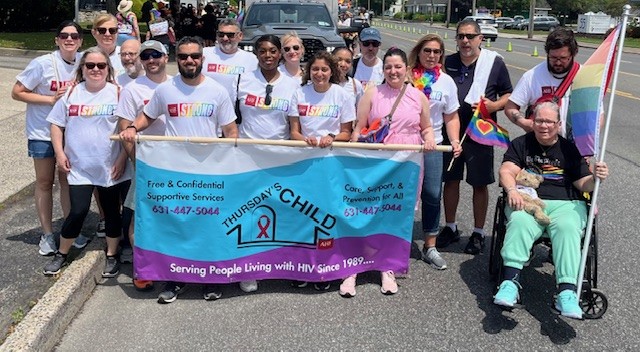 Thursday's Child outreach table with supportive services and LGBTQ+ health resources